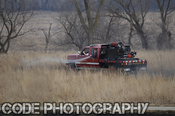 Frankfort FPD firefighters extinguish a grass fire