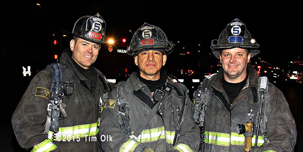 firemen after battling a fire