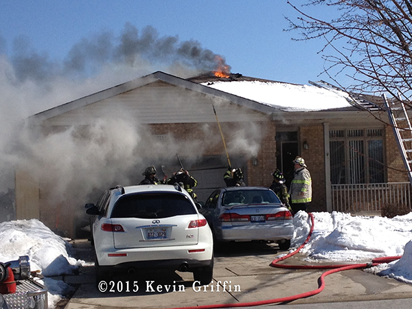 Firemen in Tinley Park (IL) at the scene of a house fire 3/7/15