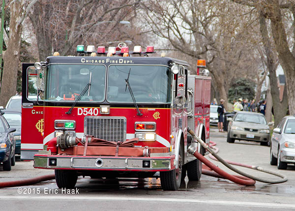 spare Chicago FD fire engine at fire scene