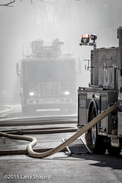 fire truck seen through smoke