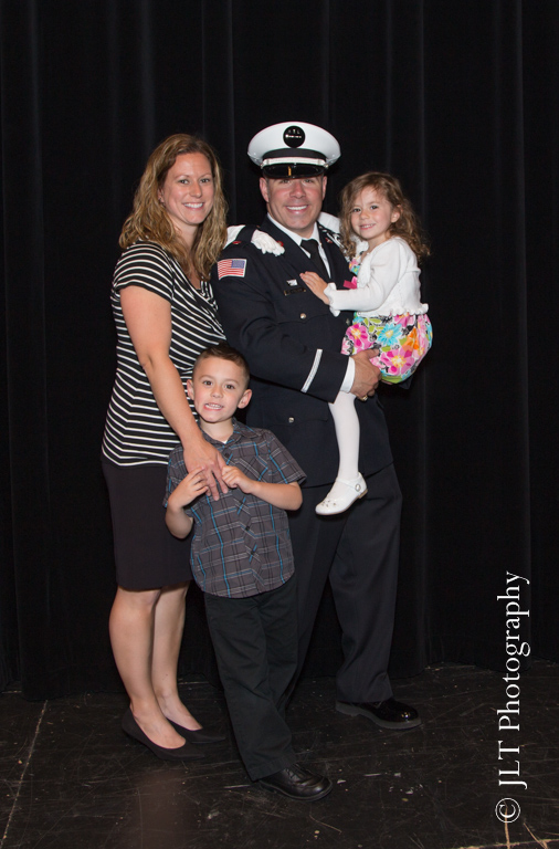 FD lieutenant with his family after being promoted