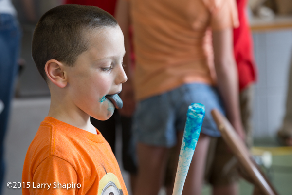 boy with blue mouth after eating cotton candy