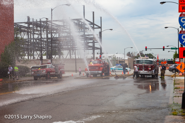 old fire engines flowing water at muster