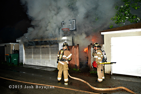 alley garage on fire at night in Berwyn IL