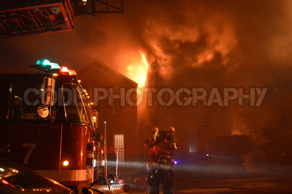 billowing flames from house fire at night