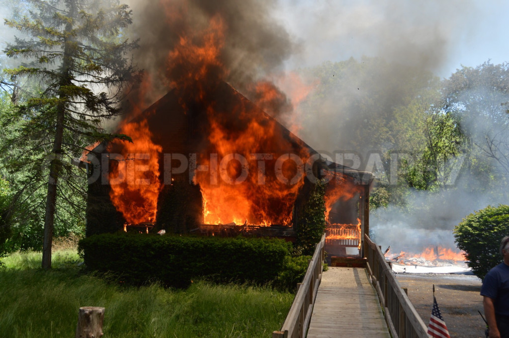 vacant house fully engulfed in fire