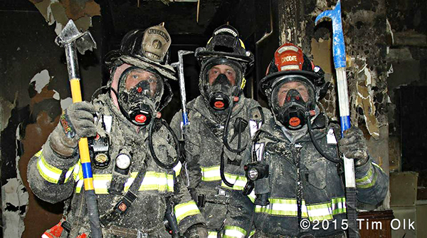 firemen pose after overhaul