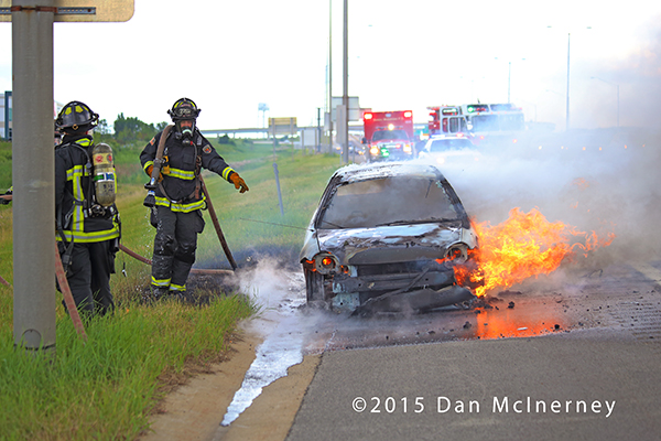 firemen extinguish a car fire