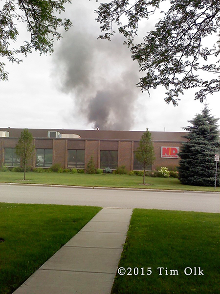 smoke from the roof of a commercial building in Northbrook IL