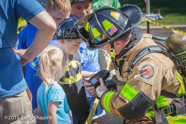fireman interacting with children