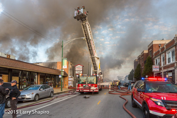 Chicago FD tower ladder working at a fire scene