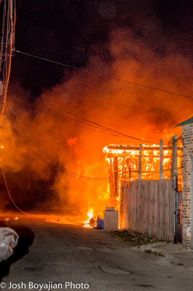 alley garages gutted by fire