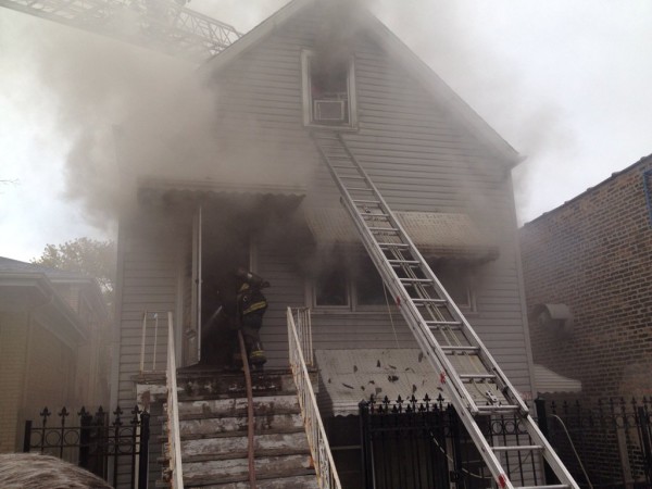 house fire with ladder to the second floor window