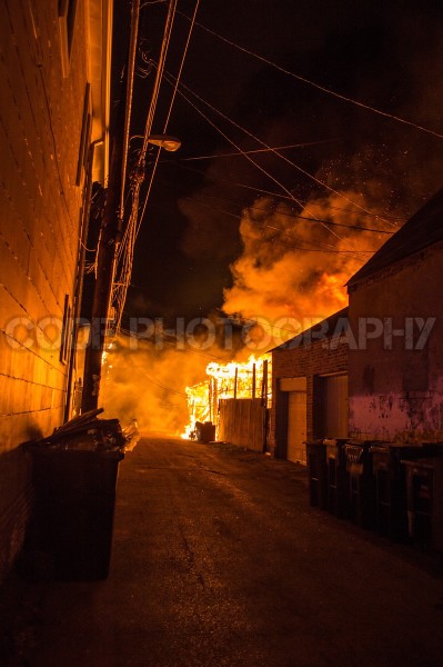 alley garages gutted by fire
