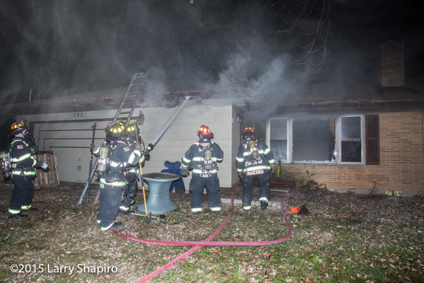 firefighters at night house fire