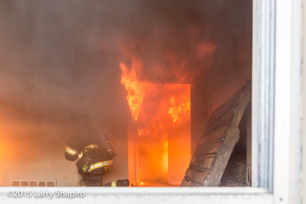 firefighter lights room on fire during training
