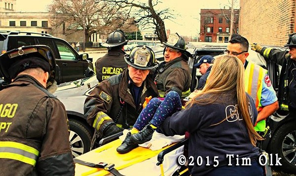 firefighters remove patient after car crash
