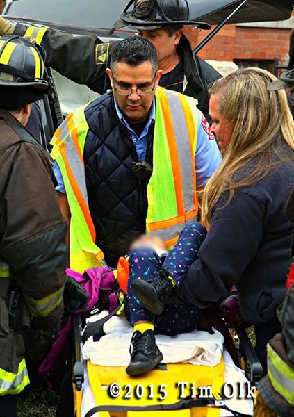 firefighters remove patient after car crash