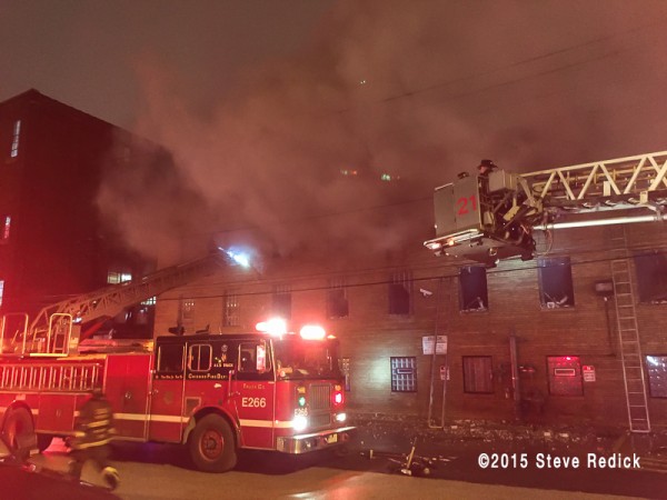 massive building fire scene in Chicago at night