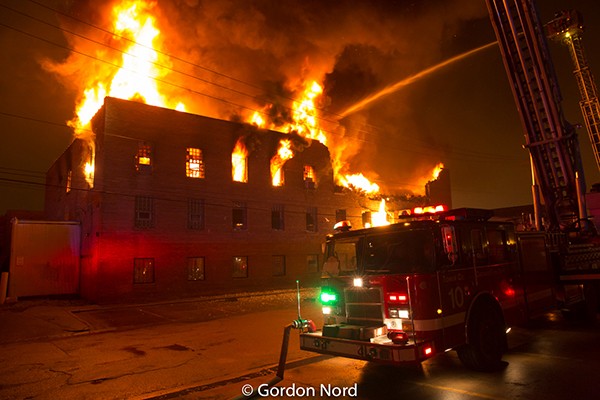 massive building fire scene in Chicago at night