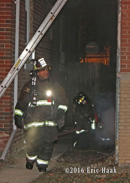 Chicago firefighters at night fire scene