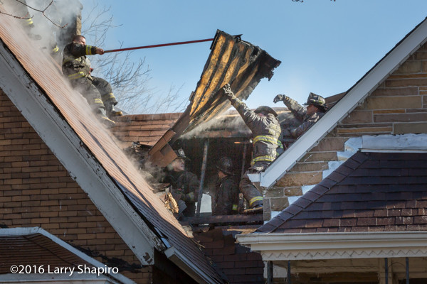 firefighters overhaul after house fire