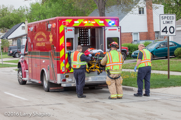 firefighters load patient with Stryker system power load
