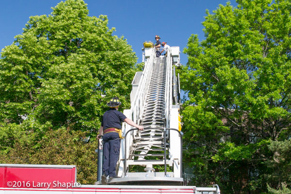 tower ladder with stokes basket removes patient