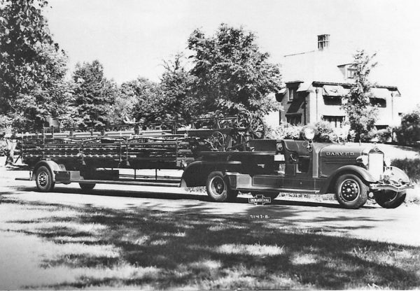 A delivery photo of the 1937 American La France tiller with a 85' wooden ladder. American La France serial # L-877