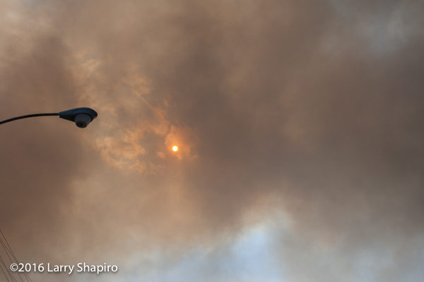 smoke from large fire obscures the sun