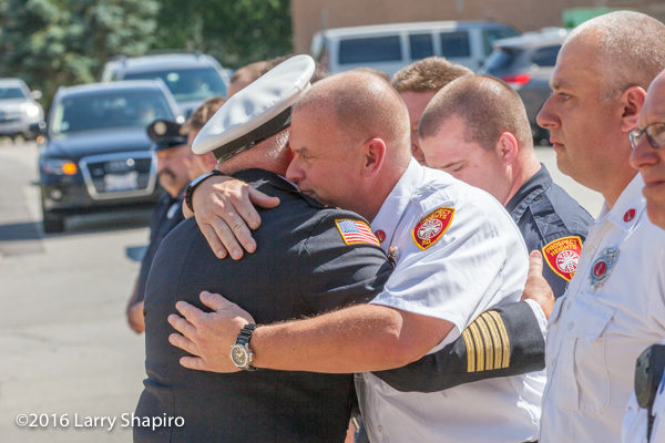 firefighter bids farewell to Prospect Heights Fire District Fire Chief Donald Gould Jr 