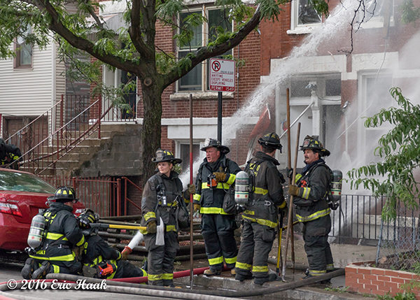 Chicago firefighters battle house fire