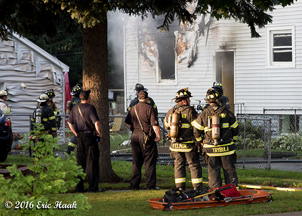 firefighters after battling a house fire