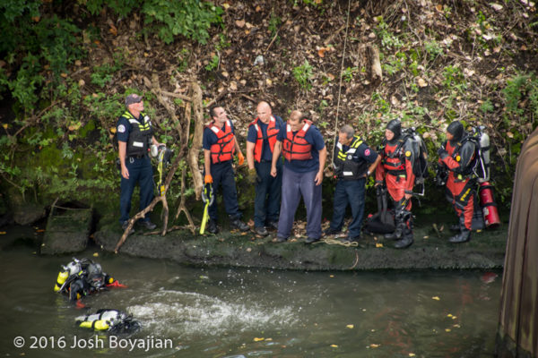 fire department divers search for victim in river