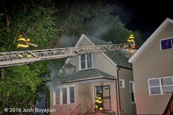 aerial ladder to house roof at nigh