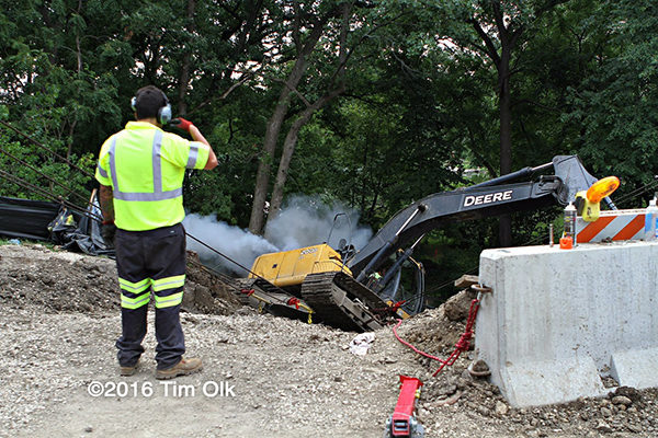 excavator rolls into ditch in Mundelein