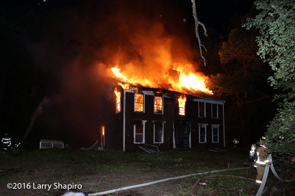 vacant house engulfed in fire