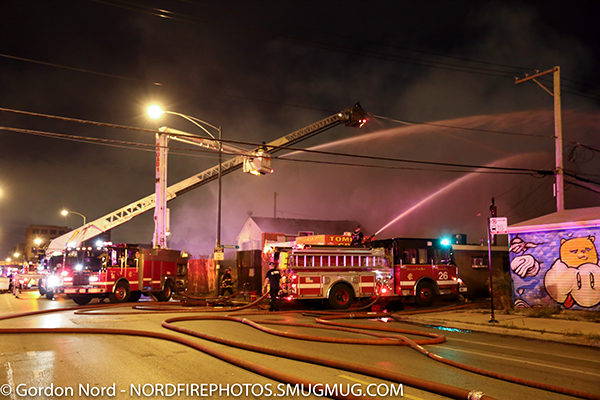 fire scene at night with fire trucks