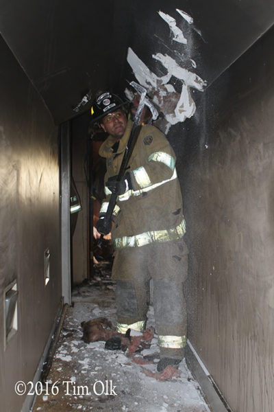firefighter pulling ceiling