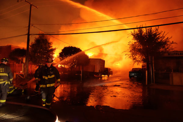 massive fire in truck yard at night