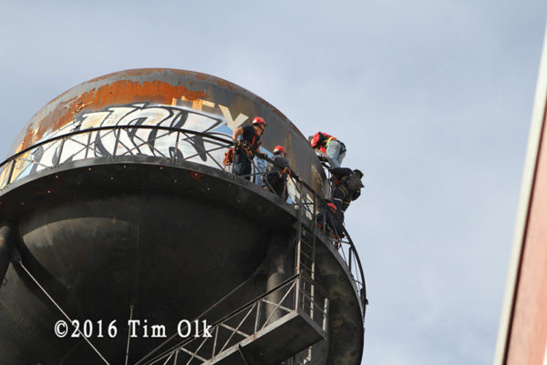 firefighters rescue worker from water tower