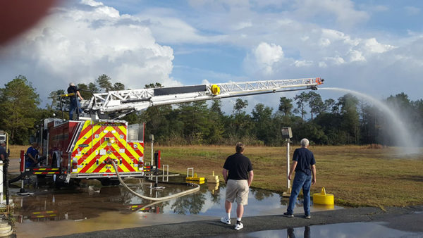 firefighters inspect new quint