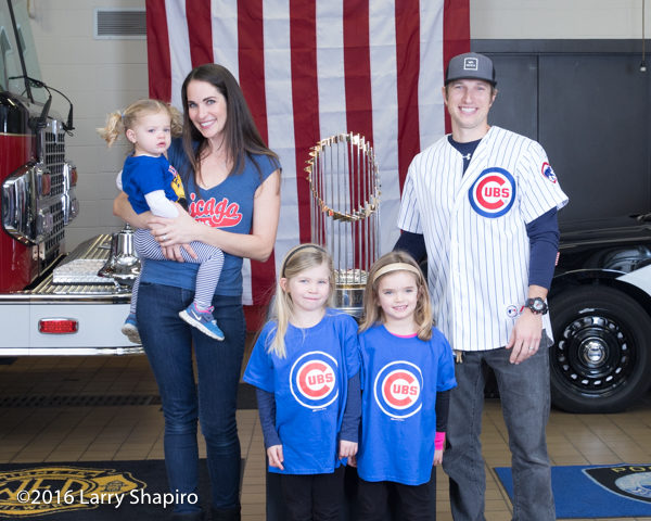 Firefighter and family with the the World Series championship trophy