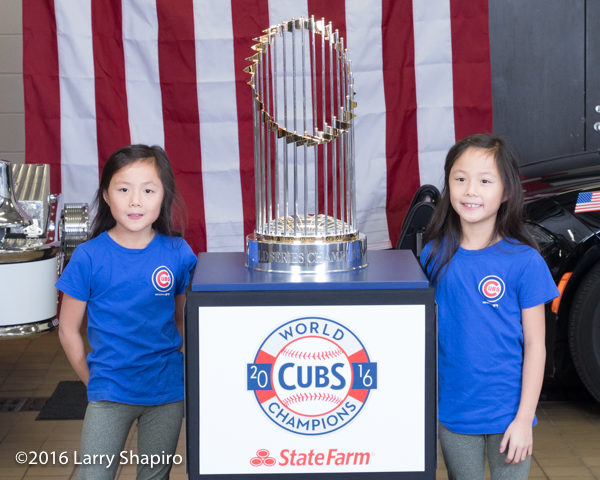 young girls with the World Series championship trophy.