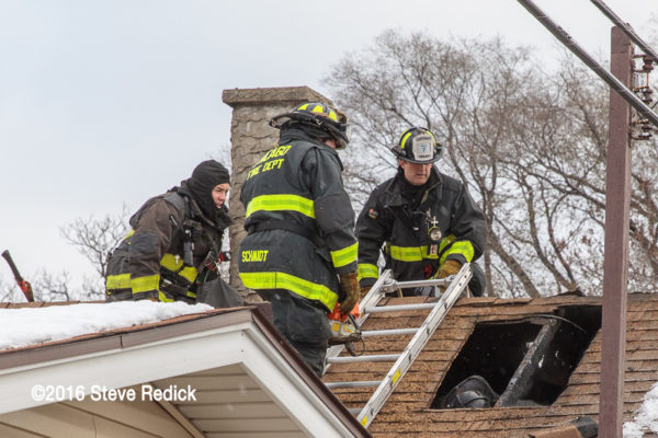 Chicago Firefighters venting a roof