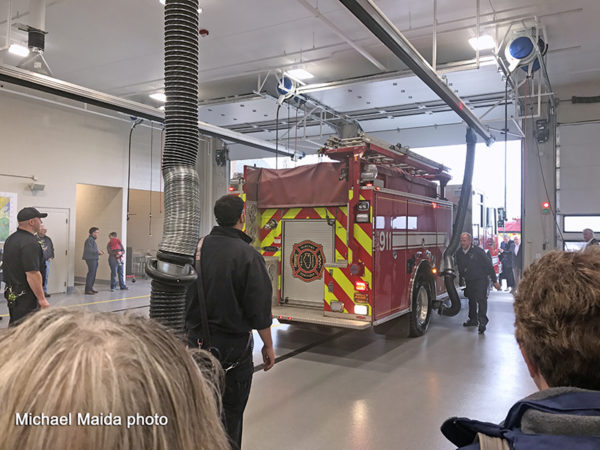 fire engine being pushed into new fire station