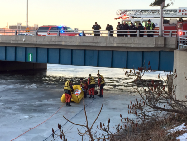 firefighters rescue victim on frozen river