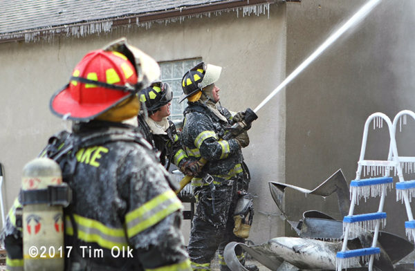 firefighters covered with ice