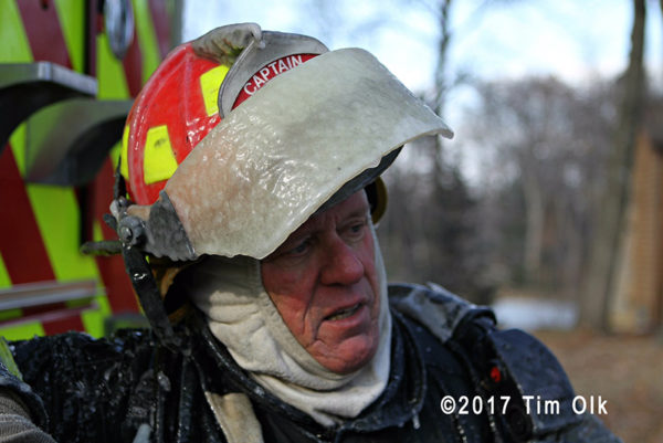 firefighter with ice covered helmet